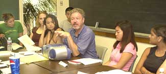 student in classroom with professor
