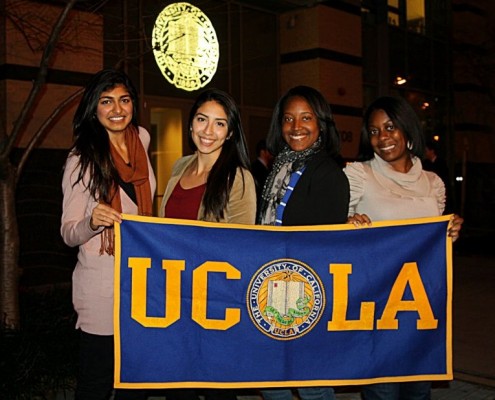 students holing UCLA banner